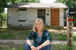 Clark, in front of one of her childhood homes: “We were living on beans.” Jeff Prince