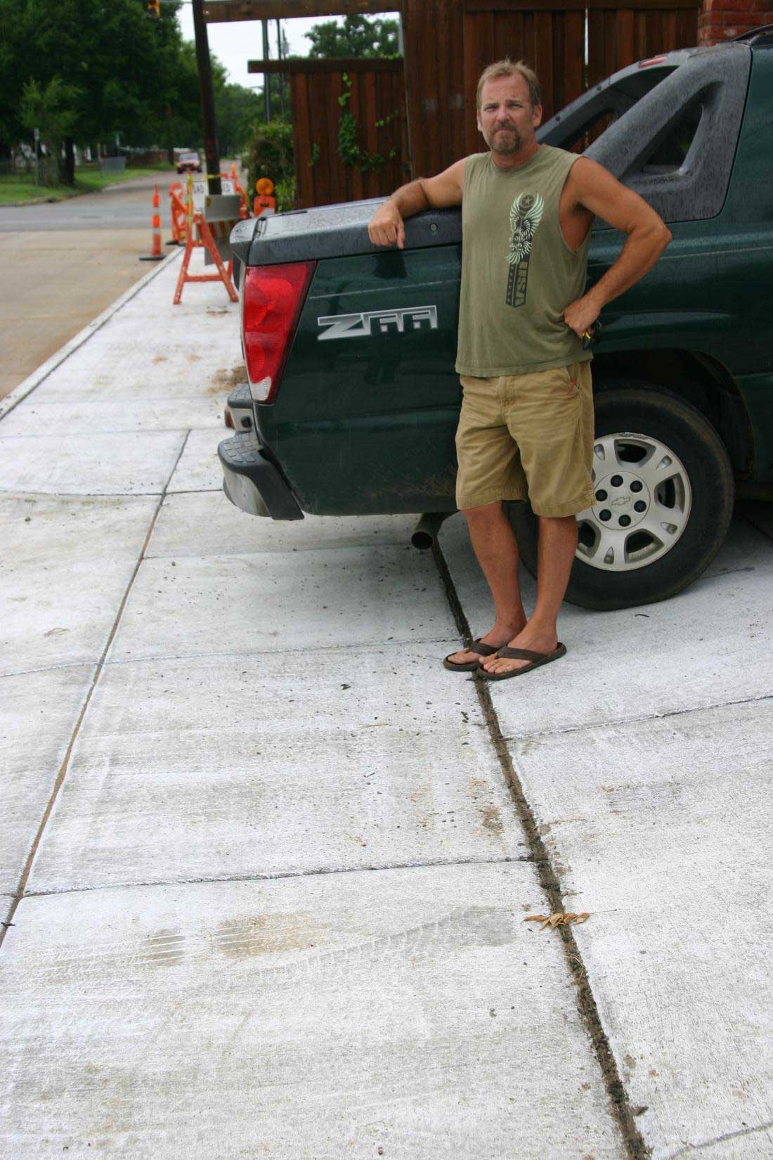 Brian Bentley’s vehicle no longer fits legally in the driveway after the city poured a sidewalk. Jeff Prince