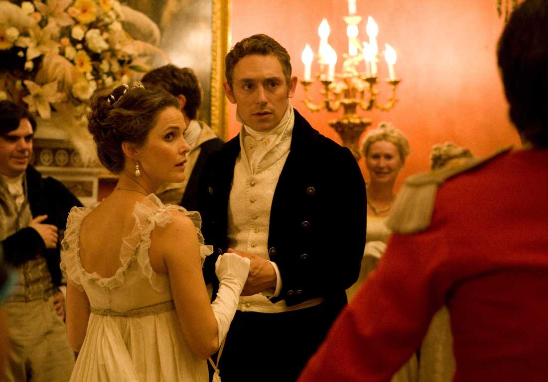 Keri Russell and JJ Feild dance a minuet in a drawing room that's not in 19th-century England in "Austenland."