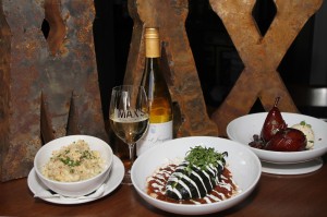 EATS2 A bottle of vino is the perfect acompaniment to Max’s (from left to right) mac ’n’ cheese, the chile relleno, and Spanish wine-soaked pears. Lee Chastain