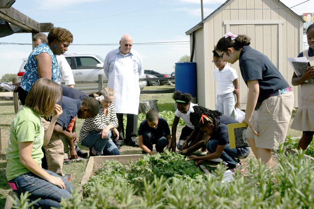 Students at T.A. Sims Elementary School tend their garden. Lee Chastain