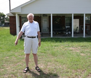 Howell points to where the Pegasus pipeline is buried under his property.  David Webb/Courtesy The Monitor