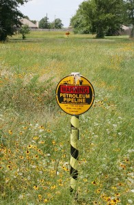 A sign warns against digging within the right-of-way for the Pegasus pipeline that runs under Cedar Creek Reservoir. David Webb/Courtesy The Monitor