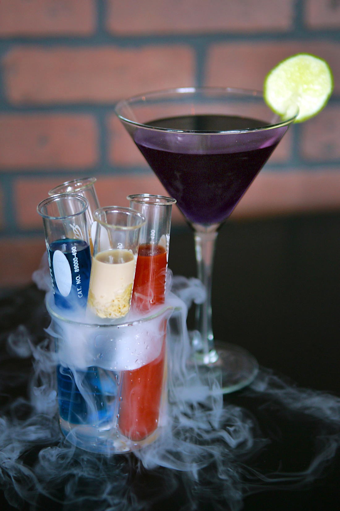 The Lab Rack, a flight of shots, is served in a smoking beaker.