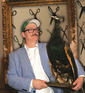 Sale, holding a stuffed peacock: “This was an art and storytelling imperative.”