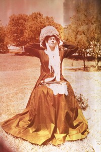 Amie Carson, as Nightingale, models a sponge cap, lace scarf, and Victorian dress. Courtesy Tom Sale