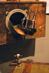 Sale fashioned dioramas using antique trunks, turn-of-the-century pipe fittings, and found objects. Lee Chastain