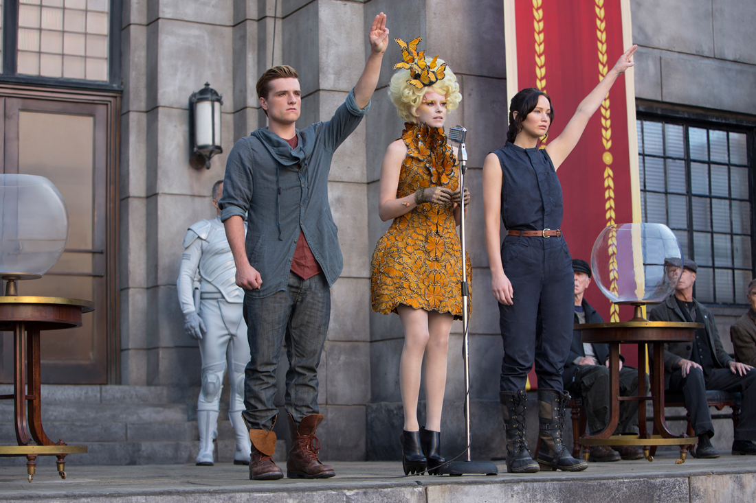 Josh Hutcherson and Jennifer Lawrence flank Elizabeth Banks and say goodbye to District 12 in The Hunger Games: Catching Fire.