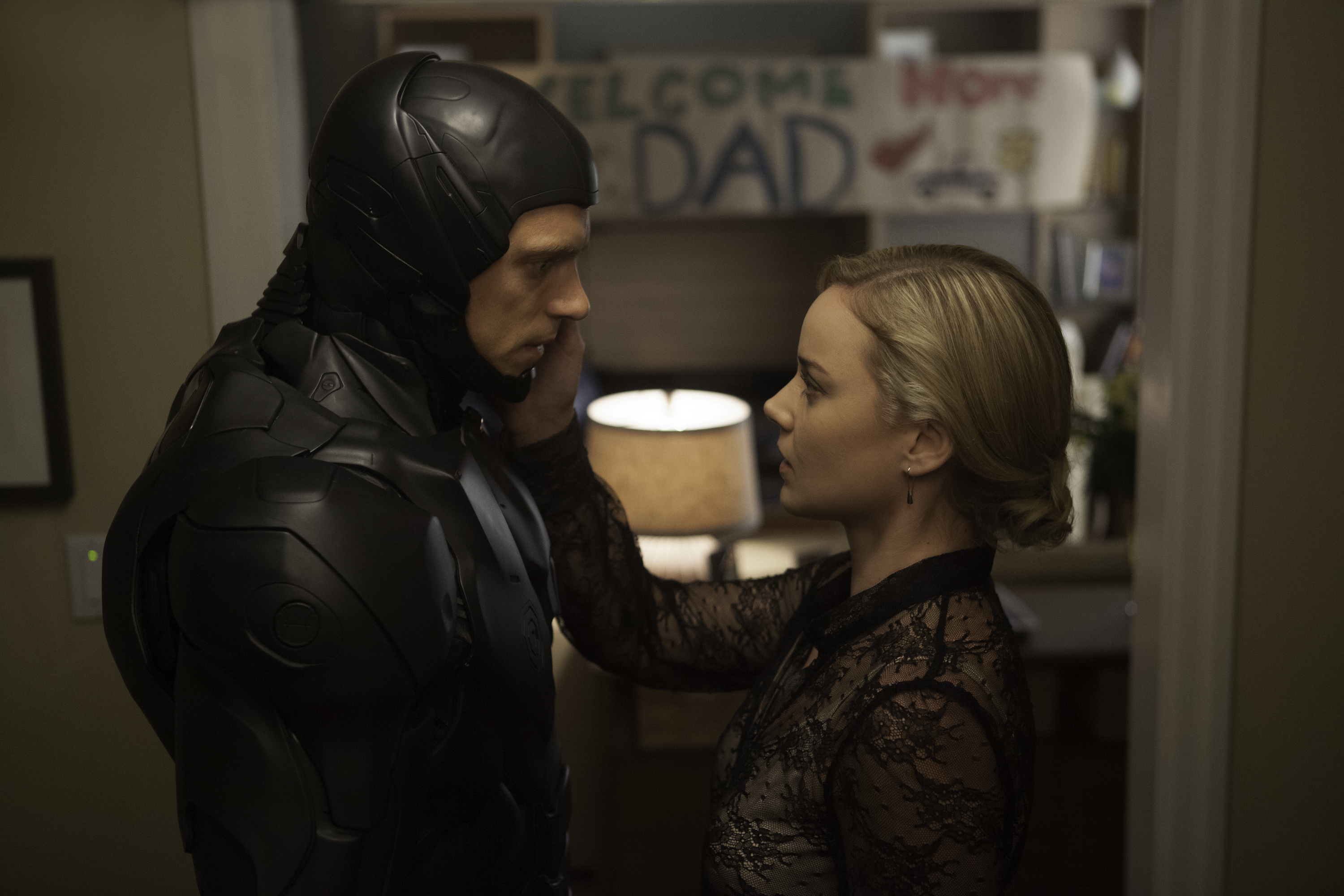 Joel Kinnaman has mixed emotions on his homecoming to Abbie Cornish in RoboCop.