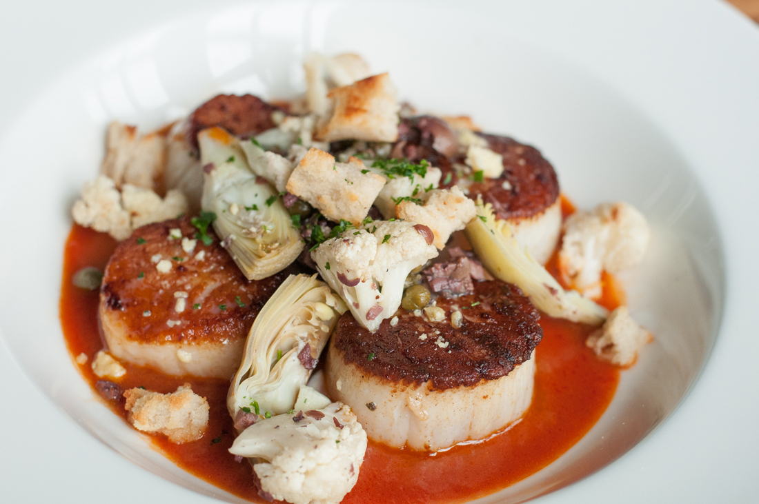 As these seared scallops prove, the food is fresh and inventive at Clay Pigeon. Brian Hutson