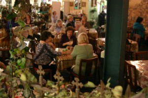 Diners enjoy quiche and key lime pie at The Secret Garden restaurant.