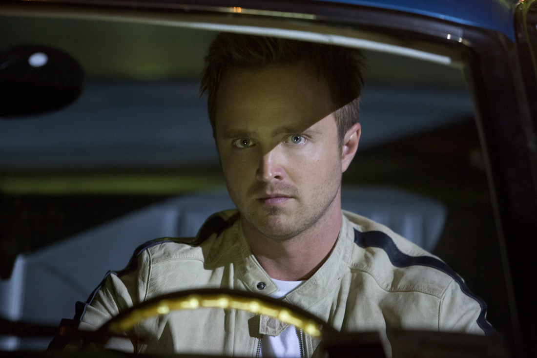 Aaron Paul focuses behind the wheel in Need for Speed.