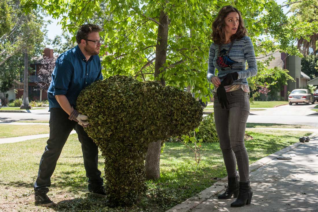 Seth Rogen and Rose Byrne find their shrubbery carved into a rude shape by the frat next door in Neighbors.