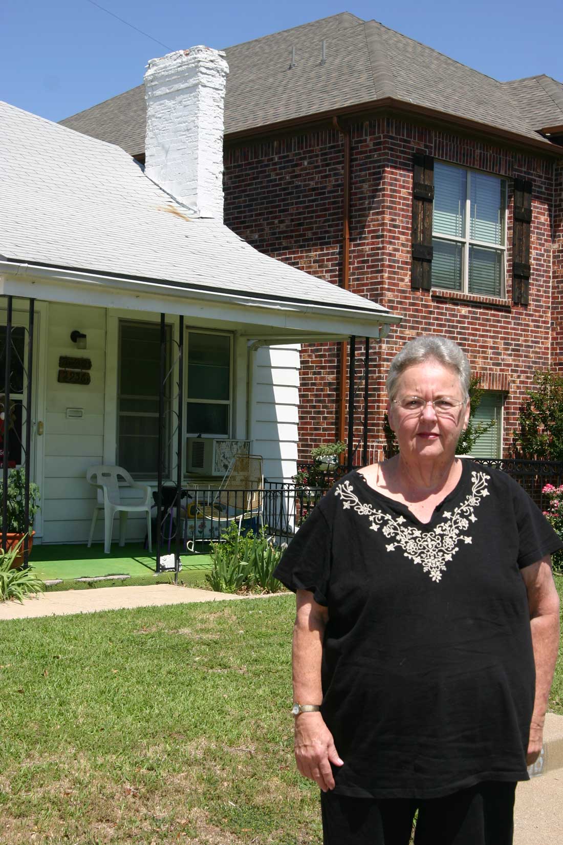 An apartment building looms over Linda Bridwell’s home. Jeff Prince