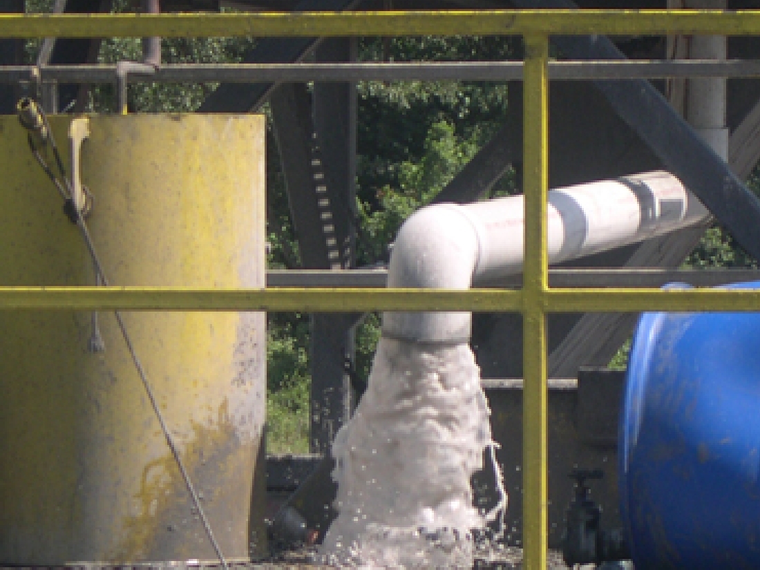 Flowback water flows fiercely at a gas rig near Everman.