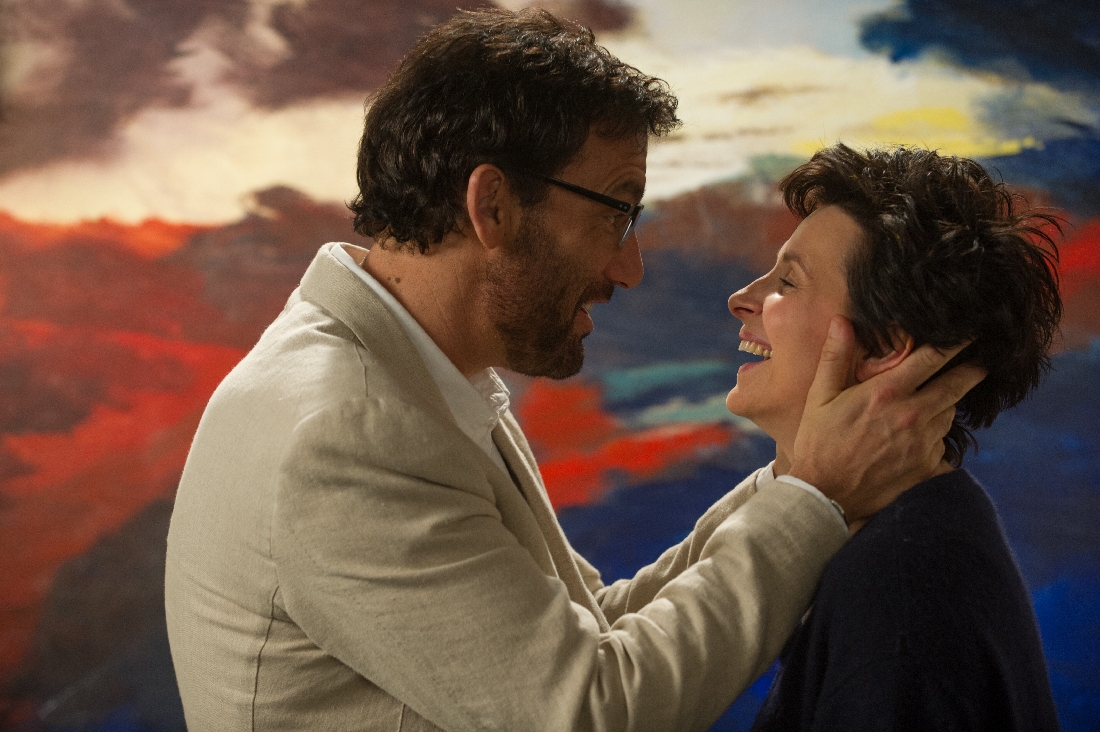 Clive Owen and Juliette Binoche share a laugh in front of one of her paintings in Words and Pictures.