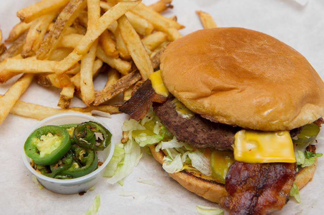 The sandwiches, like this bacon cheeseburger, aren’t fancy, but they are tasty and very wallet-friendly. Brian Hutson