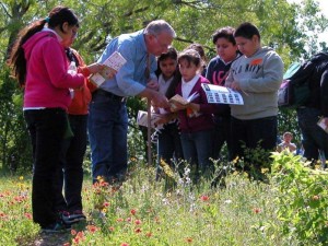 Volunteers take youngsters on prairie tours at Tandy Hills. Debora Young