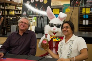 White (left) and Reymundo pose for a picture with the Spec’s mascot.