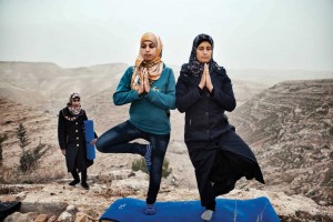 Hayat Abu R’maes and Nabila Abo teach yoga outdoors in the West Bank.