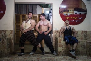 Bodybuilders in Gaza strike a pose after a workout.