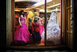 A young woman shops for a wedding dress in Gaza.