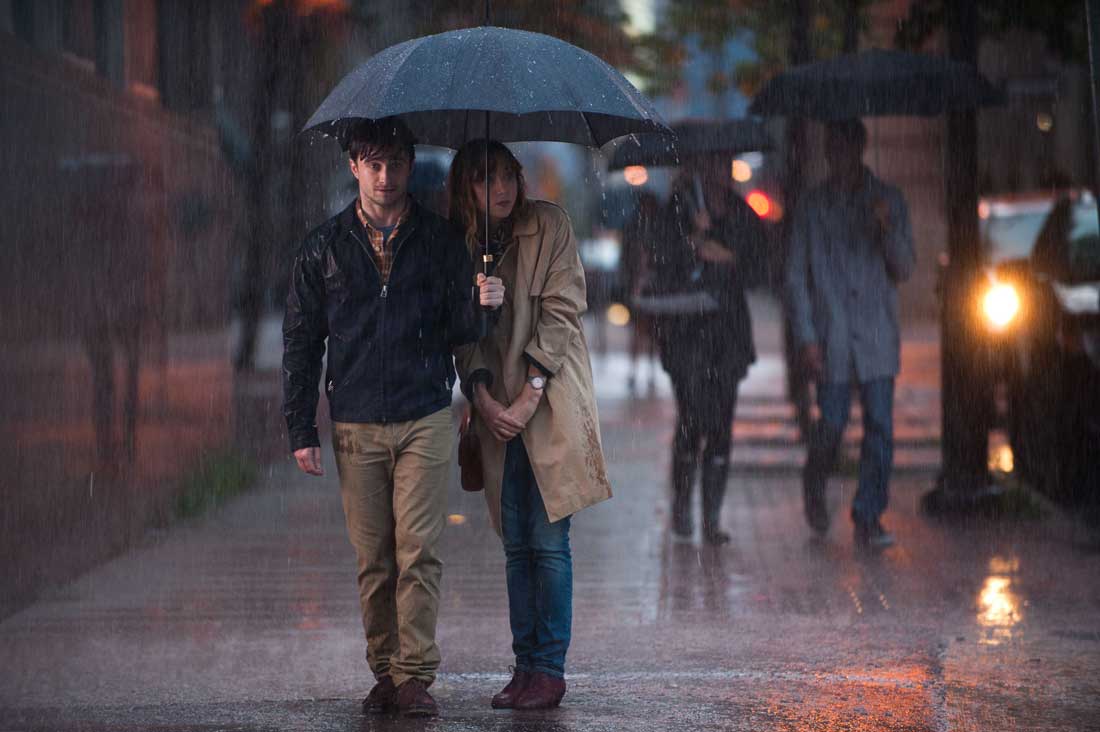 Daniel Radcliffe and Zoe Kazan share an umbrella in What If.