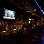 If you pop into The Boiled Owl Tavern, our favorite bar bar, you might be able to enjoy a classic B–movie. Lee Chastain