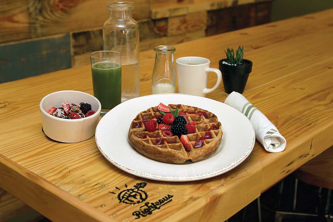 Not fancy, just fabulous: Righteous Foods’ multigrain waffle with fresh fruit juice and acai bowl.