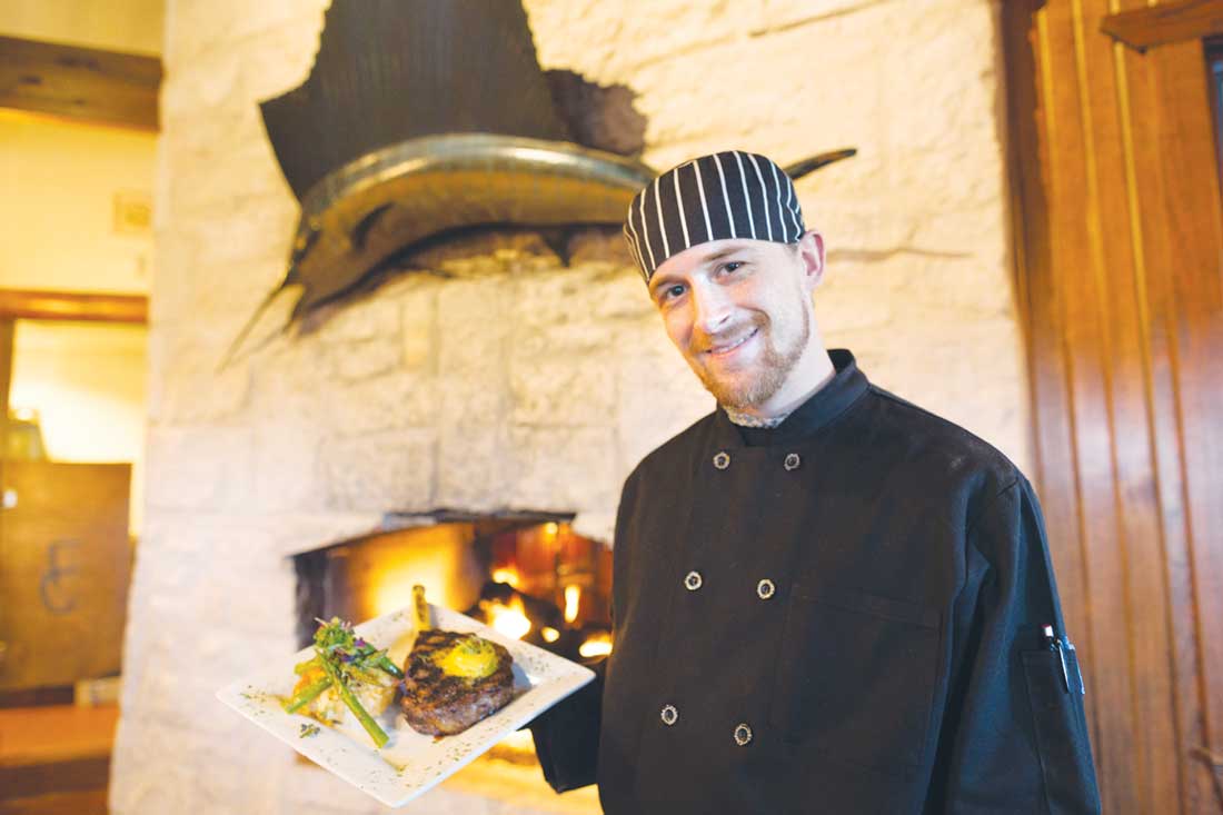 Executive chef Jordan Ray delivers a 16-oz. rib-eye finished in a 900-degree pizza oven, topped with truffle-saffron butter and accompanied by a jalapeño grit cake and grilled asparagus. Vishal Malhotra