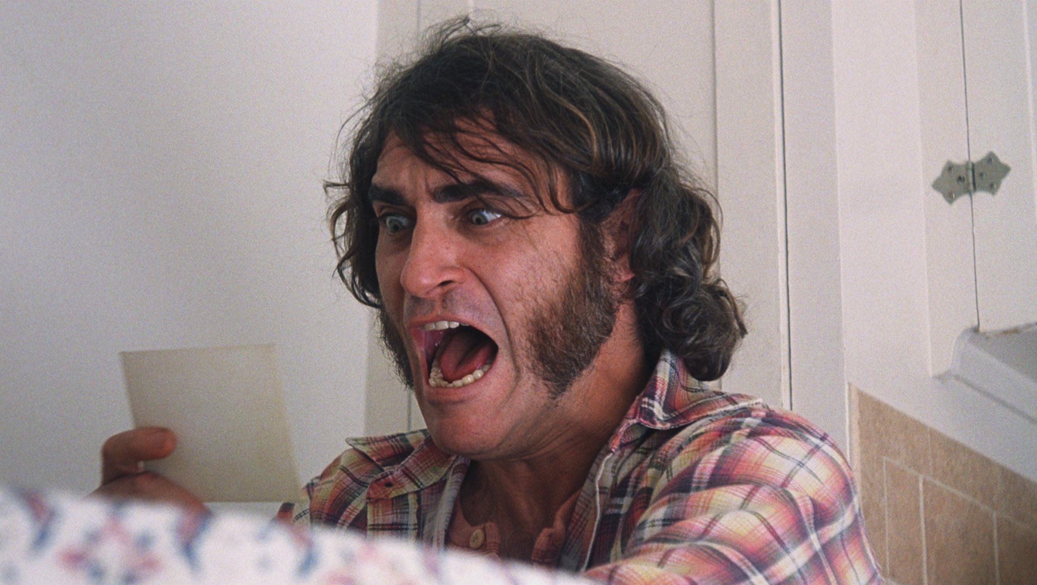 Joaquin Phoenix is flabbergasted by the complexity of his newest case in "Inherent Vice."