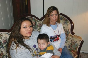 Meza (left) with her 1-year-old son and Jessica Castillo