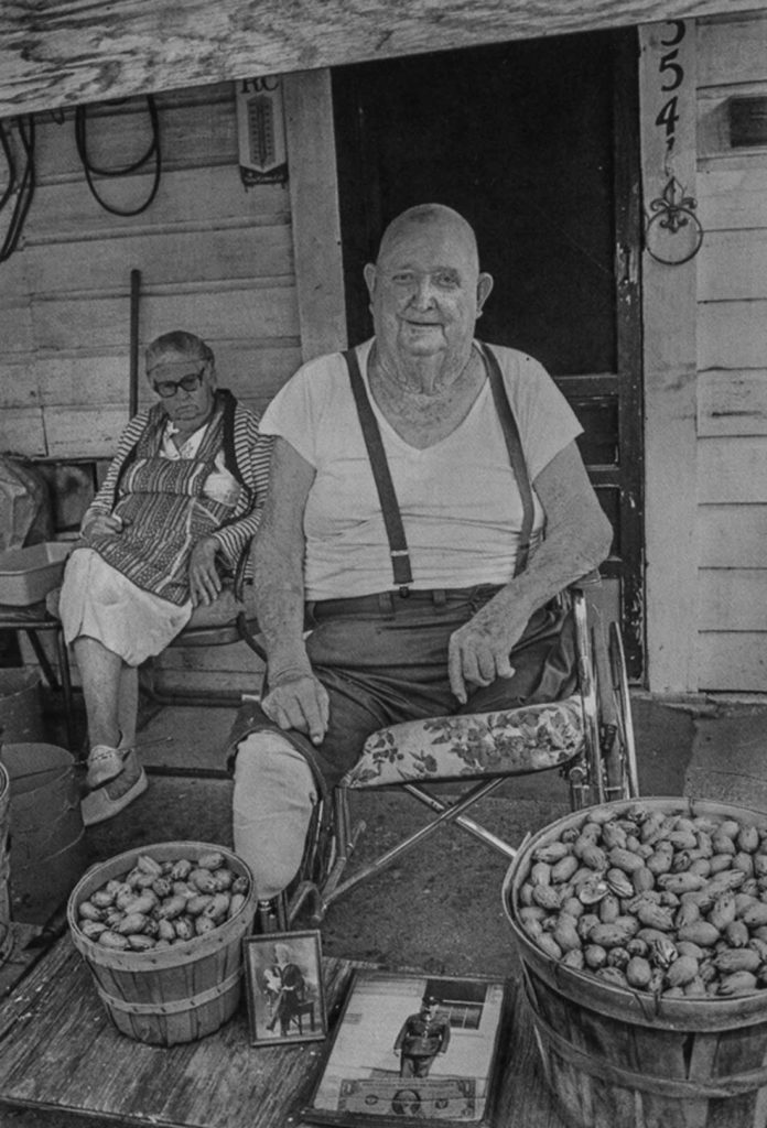 In 1982, Byrd IV took this photo of a war veteran and pecan vendor named Mr. Brown, who sold pecans from his front porch located near the Williams’ photo lab near Ripy and Jones streets. “He was whole when I first met him,” Byrd IV writes in Proof. “Diabetes kept whittling away at him until he disappeared. He was always friendly and lovable with a positive outlook on life. I would stop by occasionally and buy nuts from him so that I could photograph him, but his wife did not seem to approve. The exploitative nature of photographing strangers is always present and has only gotten worse with the digital tsunami. In my way of thinking, one must persevere because the photograph is for posterity and is bigger than him or me. We will both be dead soon enough, but the photograph will have an afterlife.”