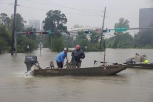 A water rescue is conducted at North Post Oak and Woodway on the outskirts of downtown Houston. Photo by Doogie Roux.