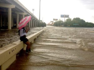 An umbrella didn’t furnish a lot of protection Sunday morning at Yale and Interstate 10. Photo by Meagan Flynn.