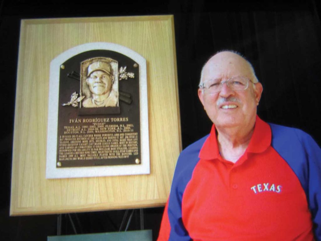 Garza poses in front of the Pudge Rodriguez plaque.