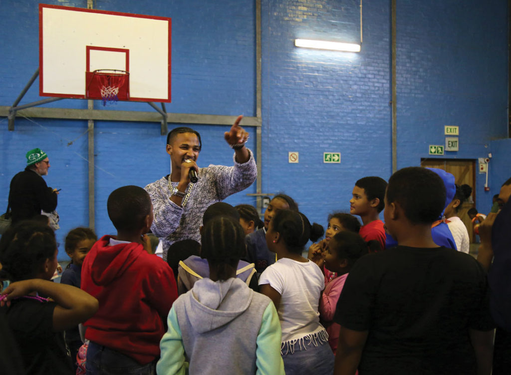 Peter Michaels hosts a Youth Day event in Hangberg. Photo by Diamon Garza.
