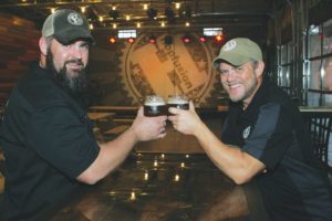 Matt Hill (left) and Macy Moore (right) have turned HopFusion Ale Works into a popular destination for folks of all ages. Photo by Lee Chastain.