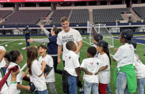 Brandon Aubrey speaks to kids